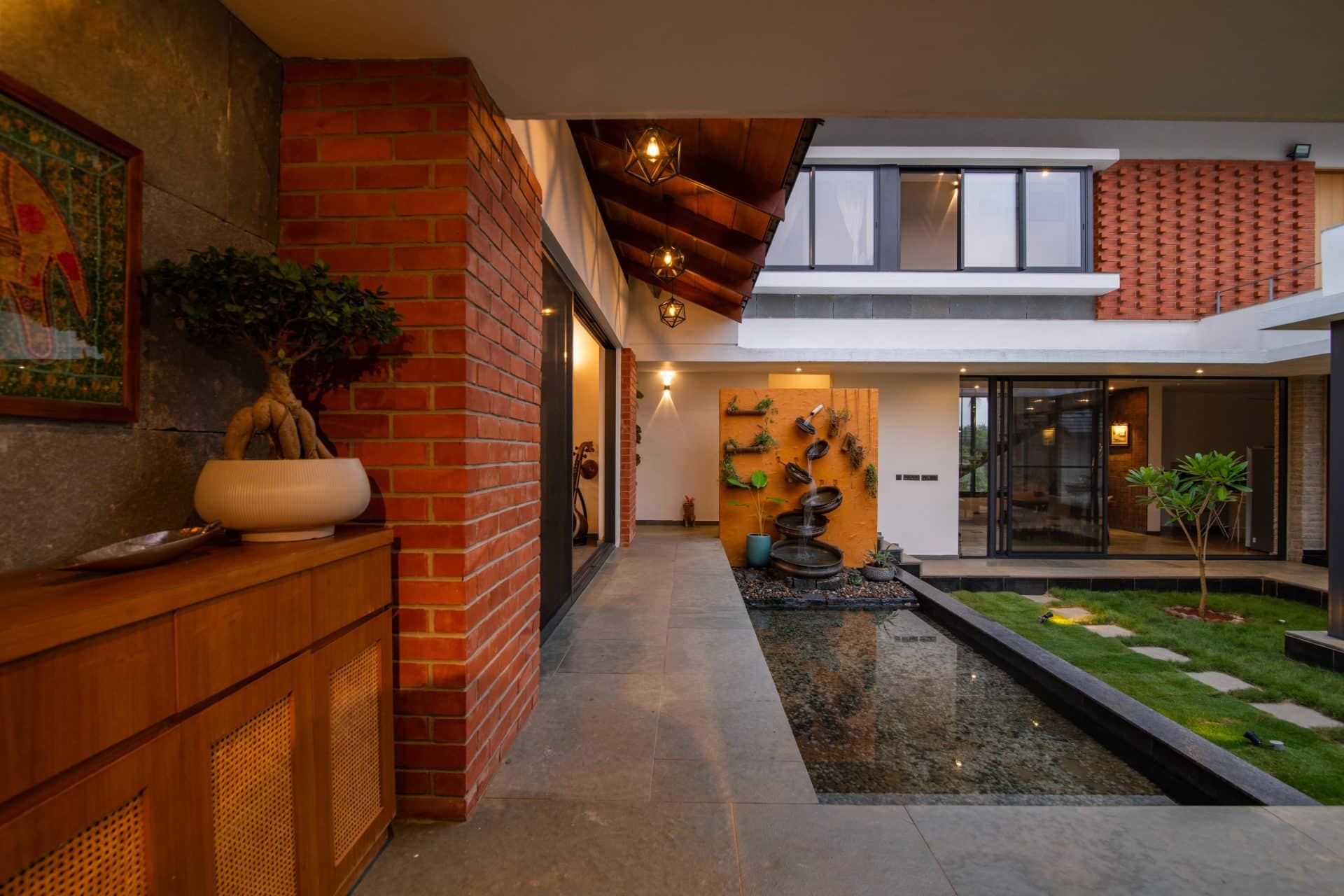 Courtyard home framed by trees and garden